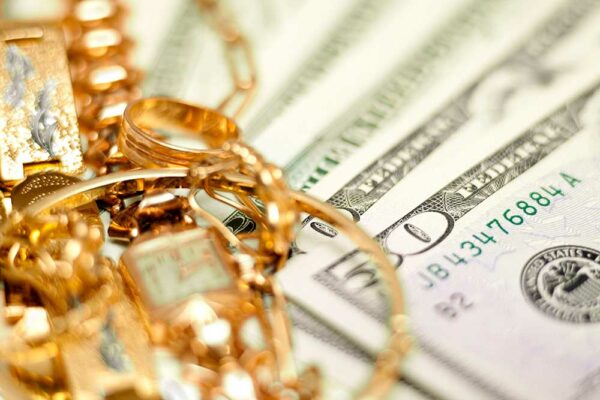 Gold jewelry and $50 cash bill